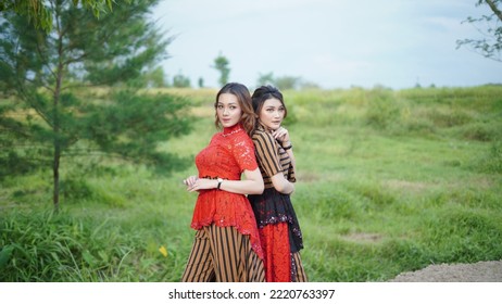 Portrait of two beautiful women in nice and beautiful clothes - Shutterstock ID 2220763397