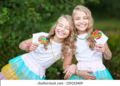 Portrait Of Two Beautifullittle Girls Twins