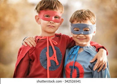 Portrait Of Two Boys In A Superhero Costume