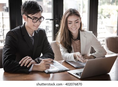 portrait of two business people discussing new project in coffee shop - Shutterstock ID 402076870