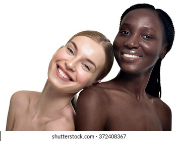 Portrait of two cheerful multiethnic women. Beautiful women, flawless skin. Diverse friends.