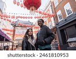 Portrait of two cheerful women in chinatown