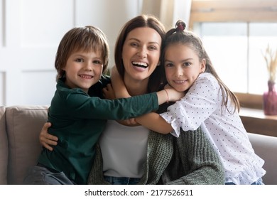 Portrait of two cute little children hug cuddle young mom feel grateful and thankful. Happy small kids embrace smiling overjoyed Caucasian mother, show love and care. Good parenthood concept. - Shutterstock ID 2177526511