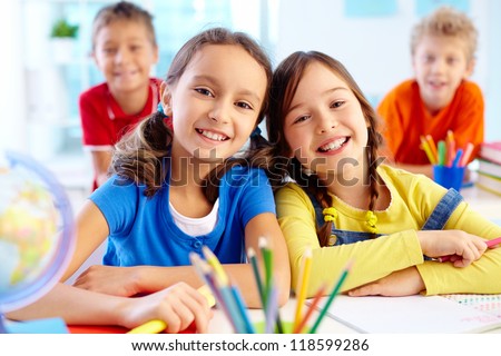 Similar – Image, Stock Photo two student girls sitting on the stairs watching the mobile