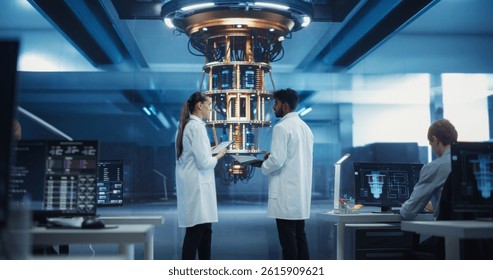 Portrait of Two Engineers Developing a High Tech Quantum Processor. Diverse Young Male and Female Scientists Using a Laptop Computer and Discussing the Project in a Research Facility