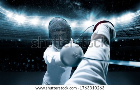 Portrait of two fencers against the backdrop of a sports arena. The concept of fencing. Duel. Mixed media