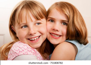 Portrait Of Two Girls Hugging