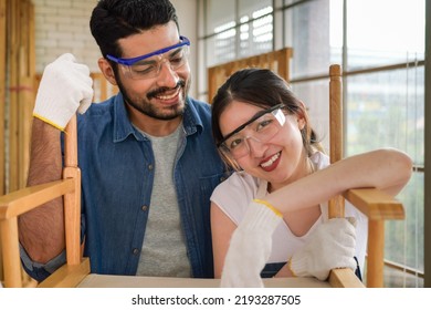 Portrait Of Two Happy Carpenters Designing And Planing Wood Products In Workshop, Smiling Couple Of Joiners In Joinery, Woodworking Job Concept