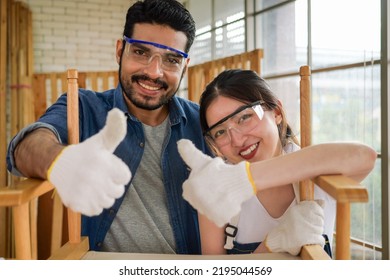 Portrait Of Two Happy Carpenters Designing And Planing Wood Products In Workshop, Smiling Couple Of Joiners In Joinery, Woodworking Job Concept