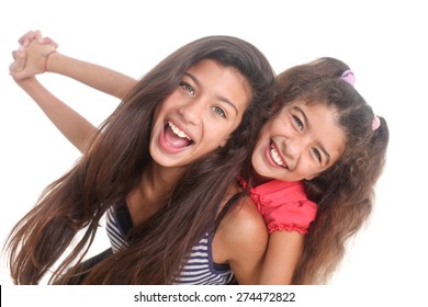 Portrait Of Two Happy Girls On A White Background