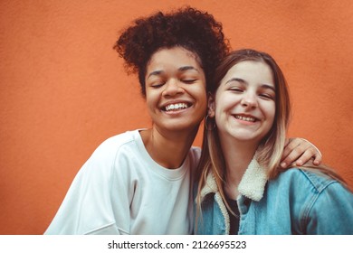 Portrait Of Two Happy Joyful Teen Girls Of Different Races Smiling At Camera, Enjoying Friendship, Multi-ethnic Best Female Friends Making Selfie Photo And Having Fun While Spending Time Together