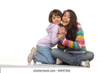 Portrait Of Two Indian Sisters Isolated On White Background