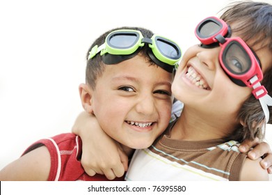 Portrait Of Two Little Children Friends Making Funny Faces And Playing Together