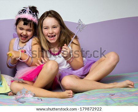 Portrait of two little girls dressed in princess