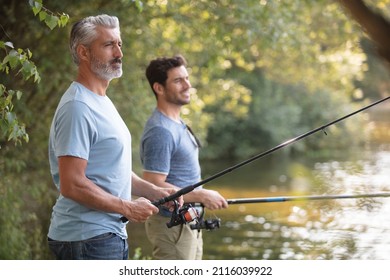 Portrait Of Two Men Fishing