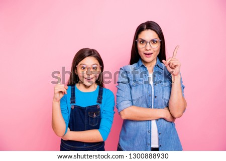 Portrait of two nice cute pretty lovely attractive charming funny brainy cheerful straight-haired girls pointing forefingers up good idea question answer decision isolated over pink pastel background