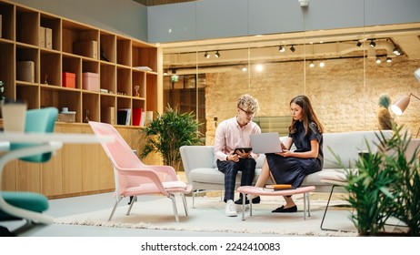 Portrait of Two People Collaborating and Pointing at the Laptop Screen in Modern Library in University. White Female Supervisor Giving Feedback on Thesis Draft to a Male Student - Powered by Shutterstock