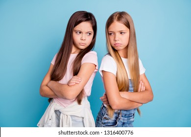 Portrait Of Two People Nice Cute Lovely Attractive Sad Mad Offended Gloomy Straight-haired Pre-teen Girls Standing Back To Back Folded Arms Isolated Over Blue Pastel Background