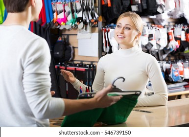 Portrait Of Two Persons At The Cashier In The Clothing Shop