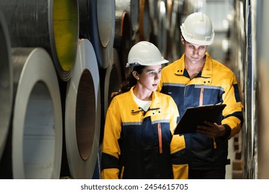 Portrait of Two Professional Engineers Use Industrial Digital Tablet to Work with Augmented Reality. Great Template Shot for Augmented Reality. Factory Workshop. engineer man and woman manager leader - Powered by Shutterstock