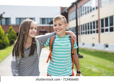 Portrait Of Two School Friends With Backpacks