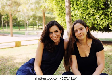 Portrait Of Two Smiling 40 Years Old Women Outdoors