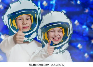 Portrait Of Two Smiling Kids In Space Suits. Cosmonautics Day Concept.