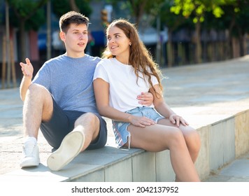 Portrait Of Two Teenage Friends Chatting Outdoors In Town