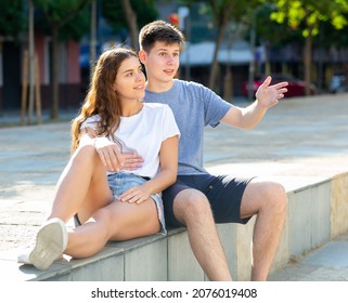 Portrait Of Two Teenage Friends Chatting Outdoors In Town