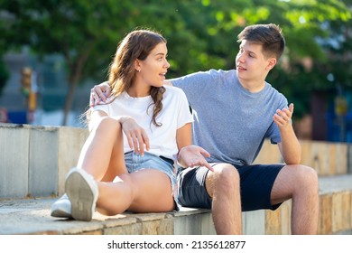 Portrait Of Two Teenage Friends Chatting Outdoors In Town