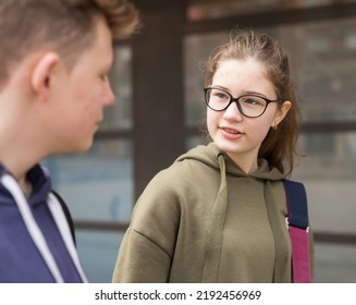 Portrait Of Two Teenage Friends Chatting Outdoors In Town