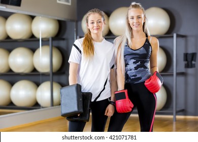 Portrait Of Two Women At Boxing Training In Fitness Gym