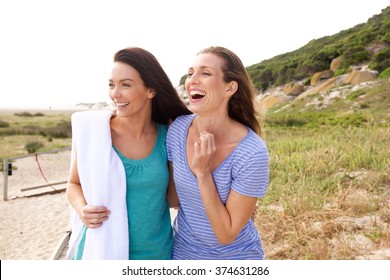 Portrait Of Two Women Laughing In A Park