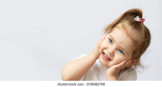 Portrait Of A Two Year Old Girl Isolated On White Background