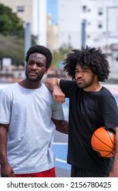 Portrait Of Two Young Basketball Teammates