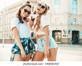 Portrait of two young beautiful smiling hipster female in trendy summer white t-shirt clothes.Sexy carefree women posing on street background. Positive models having fun, hugging and going crazy - Shutterstock ID 1908581947
