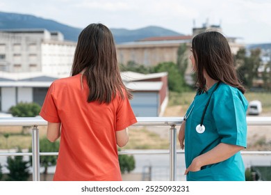 Portrait of Two Young Female Beautiful Healthcare Workers Enjoying a Relaxing Break - Powered by Shutterstock