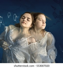 Portrait of two young girls in water