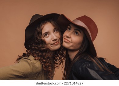 Portrait of two young happy girls, studio shoot, - Shutterstock ID 2271014827