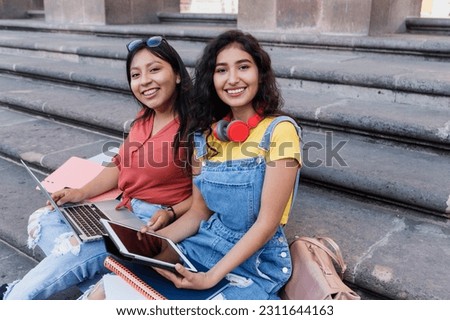 portrait of two young latin girls university students in Mexico Latin America, hispanic girls studying	