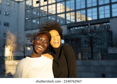 Portrait Two Young Women Of Generation Z, Happiness And Laughter As The Wind Moves Into A Sunny And Windy Day