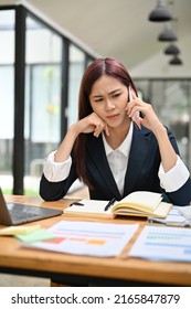 Portrait of an unhappy female boss or businesswoman unsatisfied with the business deal from her partner on the phone call. Businesswoman with a serious phone call.