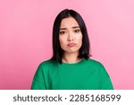 Portrait of unhappy sad woman straight hairstyle oversize t-shirt pouted lips looks disappointed isolated on pink color background