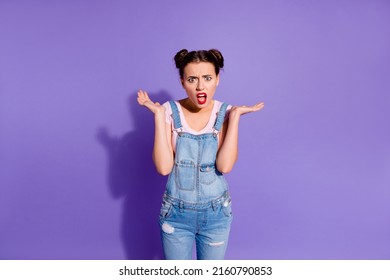 Portrait of unsatisfied impressed girl scream shout bad mood isolated on purple color background