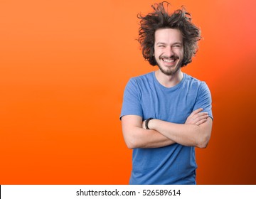 Portrait Of Urban Bearded Man With Funny Hair Against Color Background With Copy Space