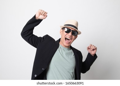 Portrait Of An  Very Happy Adult Asian Man In Sunglasses On White Background