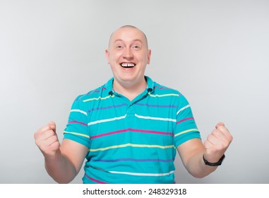 Portrait Of A Very Happy Young Man With His Arms Raised