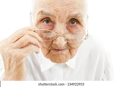portrait of a very old woman taking off  her glasses