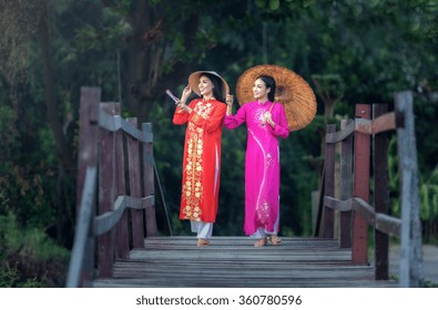 Portrait of Vietnamese girl traditional dress, Ao dai is famous traditional costume for woman in Vietnam