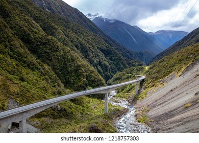 Portrait view of Otira Viaduct from Arthurs Pass through the Otira Gorge over a stunning valley with mountains on either side and river down below